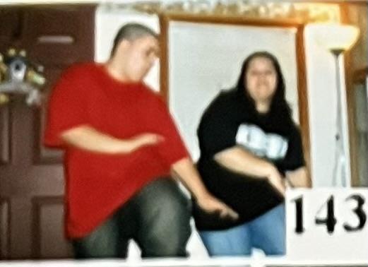 A man and woman posing for a picture