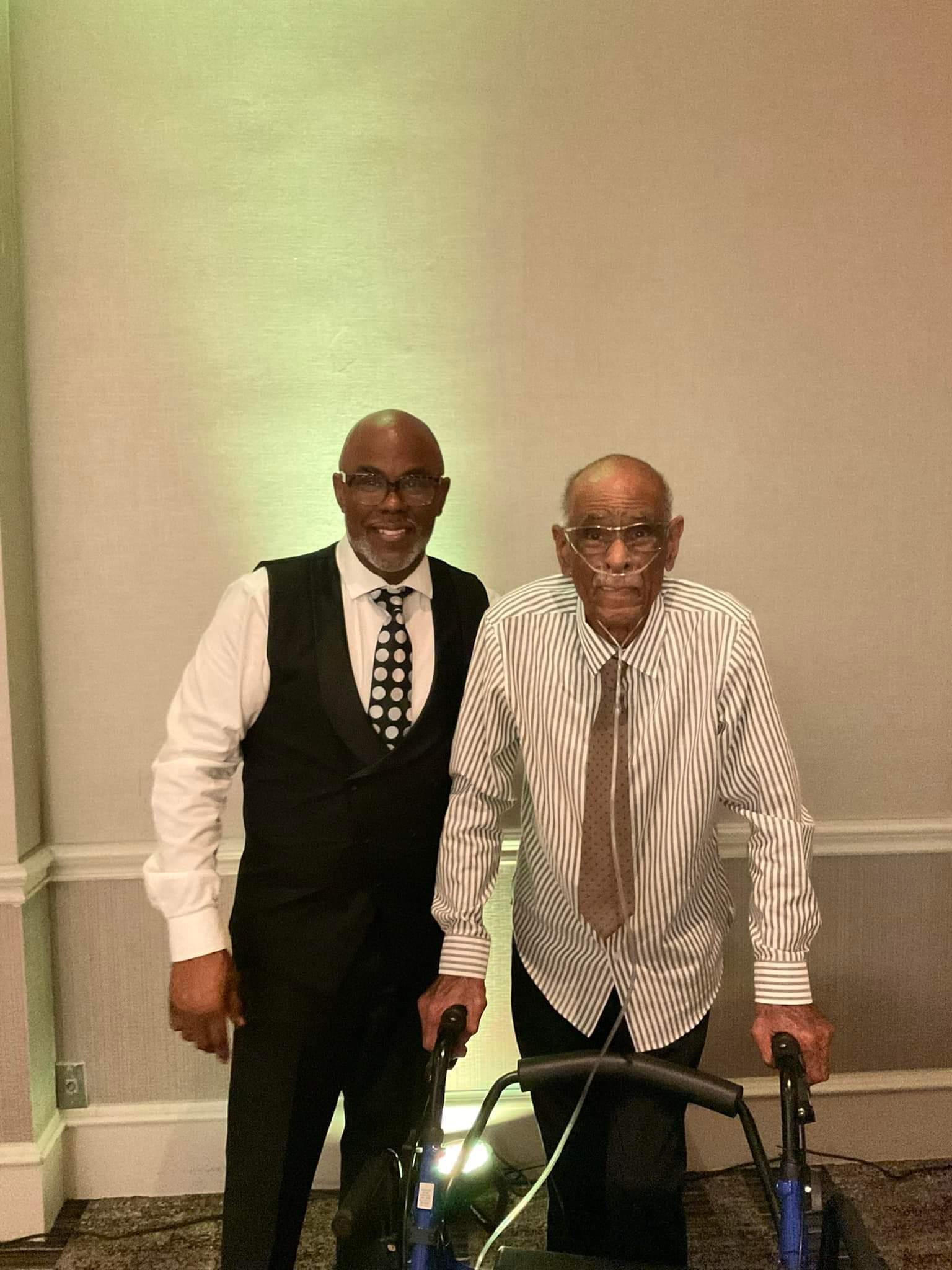 Two men standing next to each other