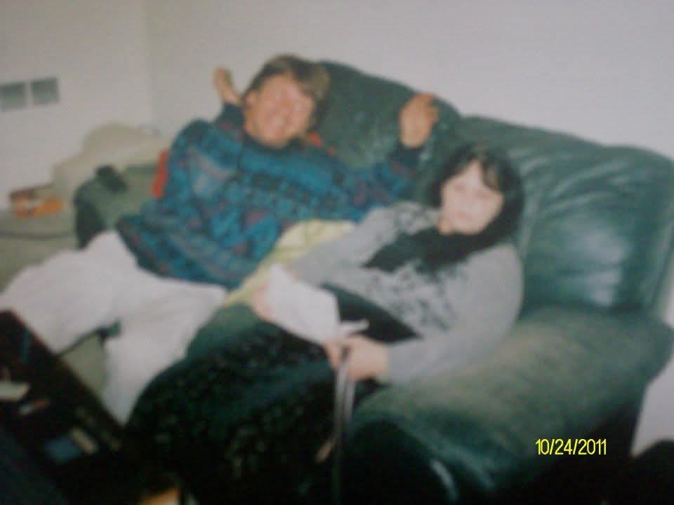 A man and woman sitting on a couch