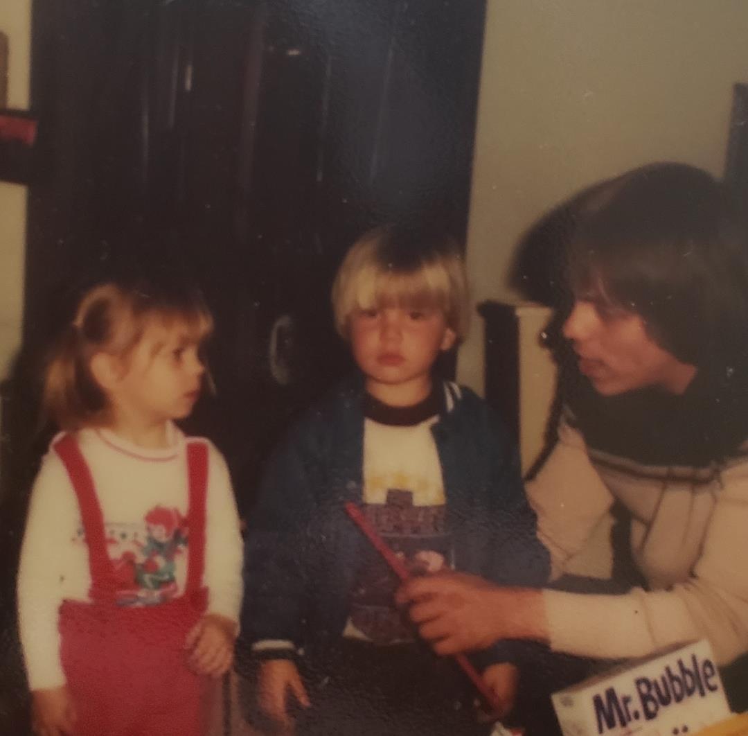 A man and two children
