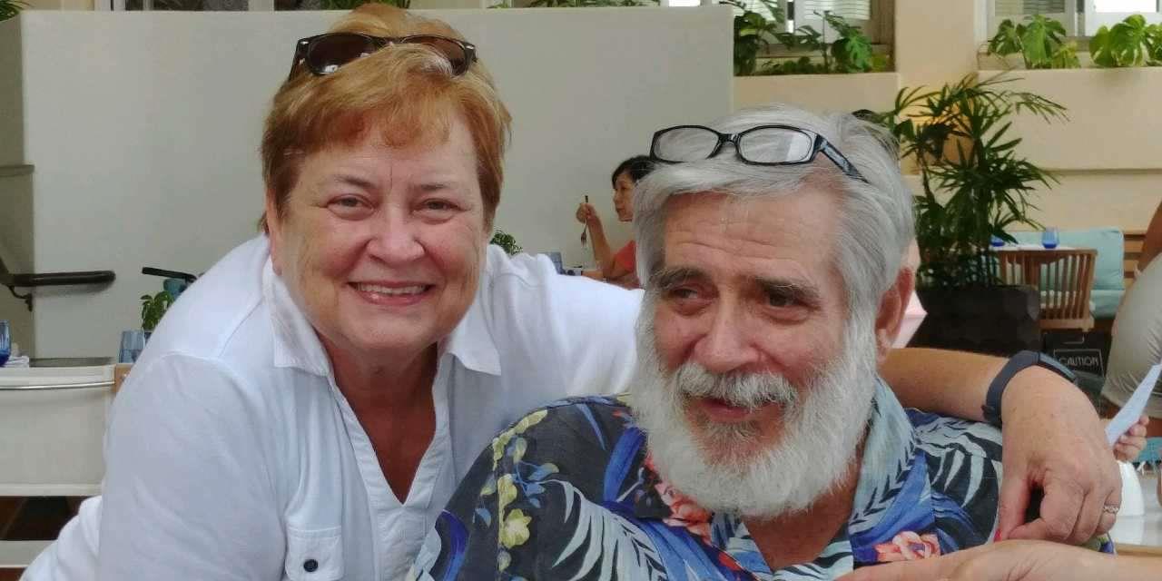 A man and woman smiling for a picture