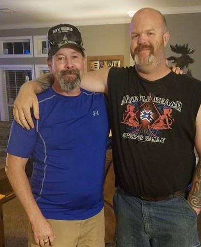 Two men posing for a picture