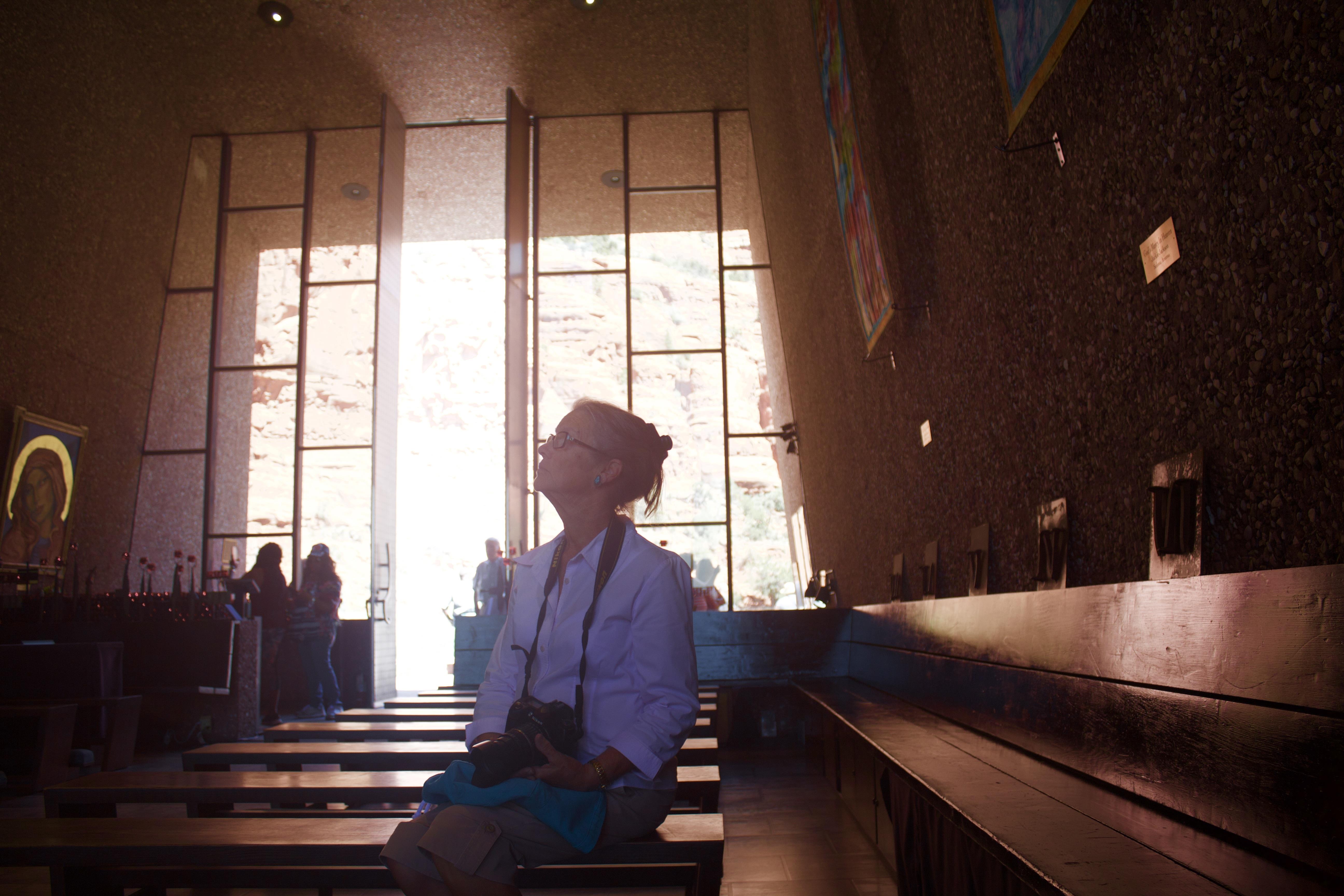 A woman sitting in a church