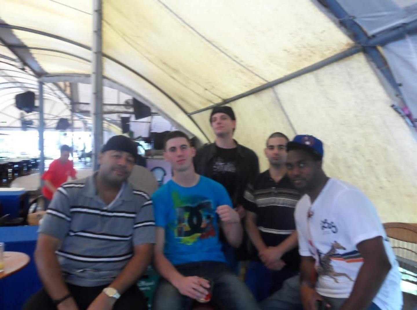 A group of men posing for a photo