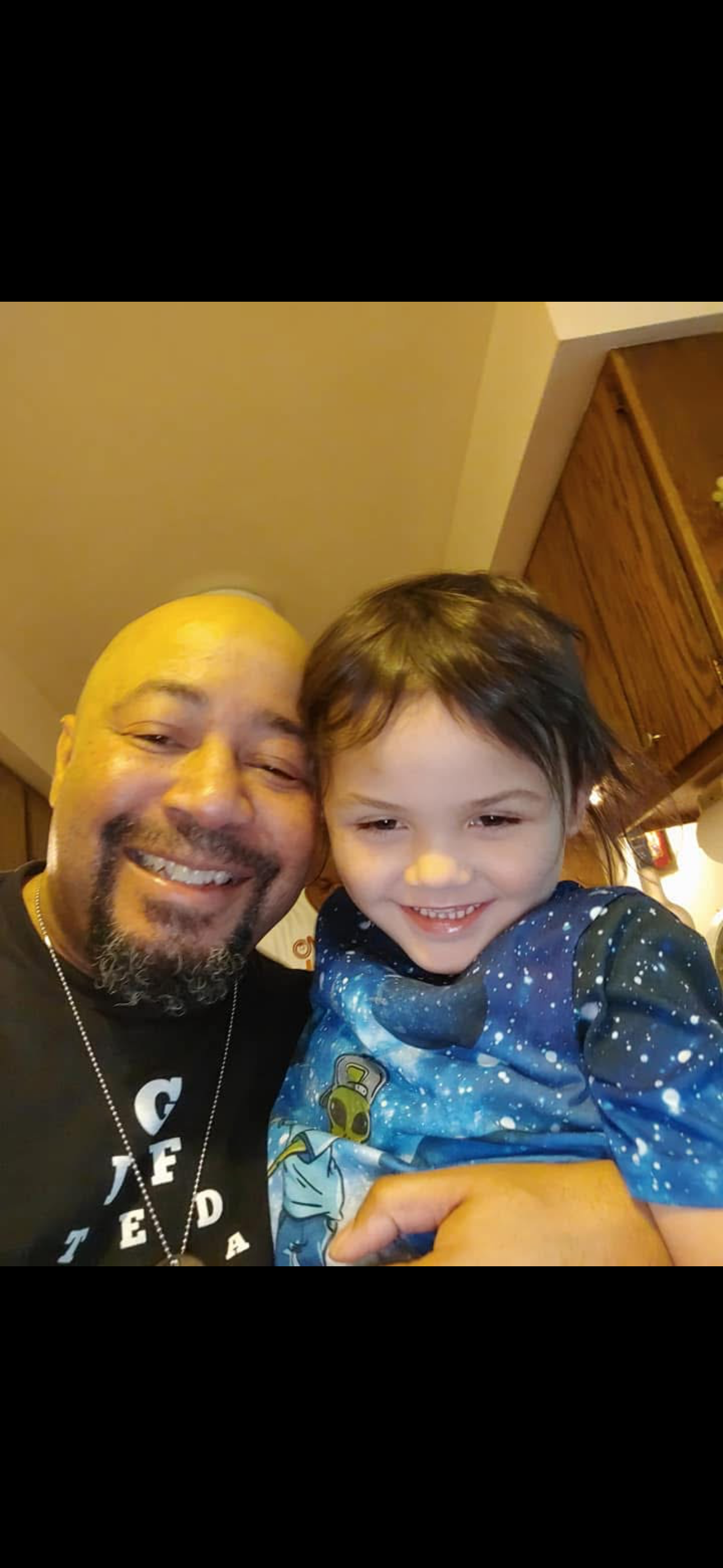 A man and child taking a selfie