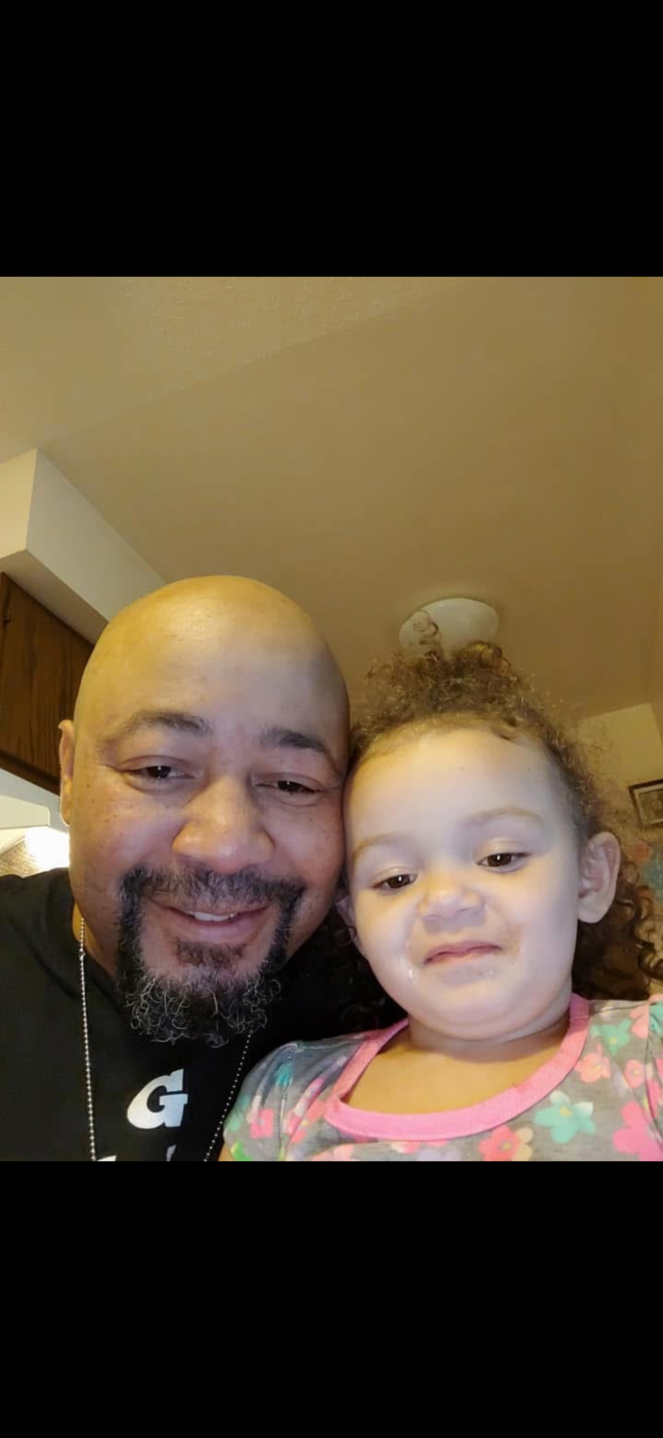 A man and a child taking a selfie
