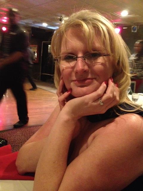 A woman with her hands on her chin