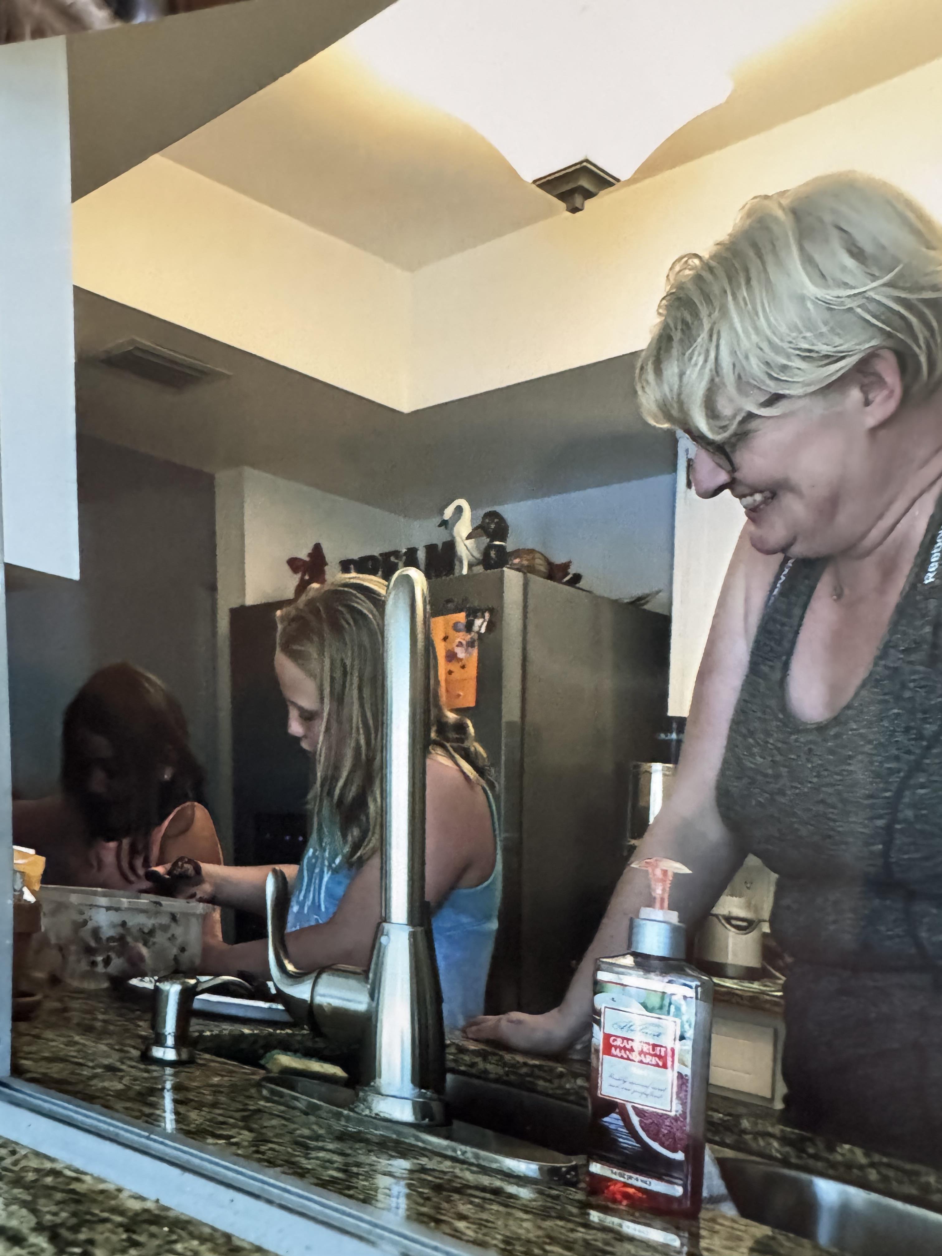 A woman and a girl in a kitchen