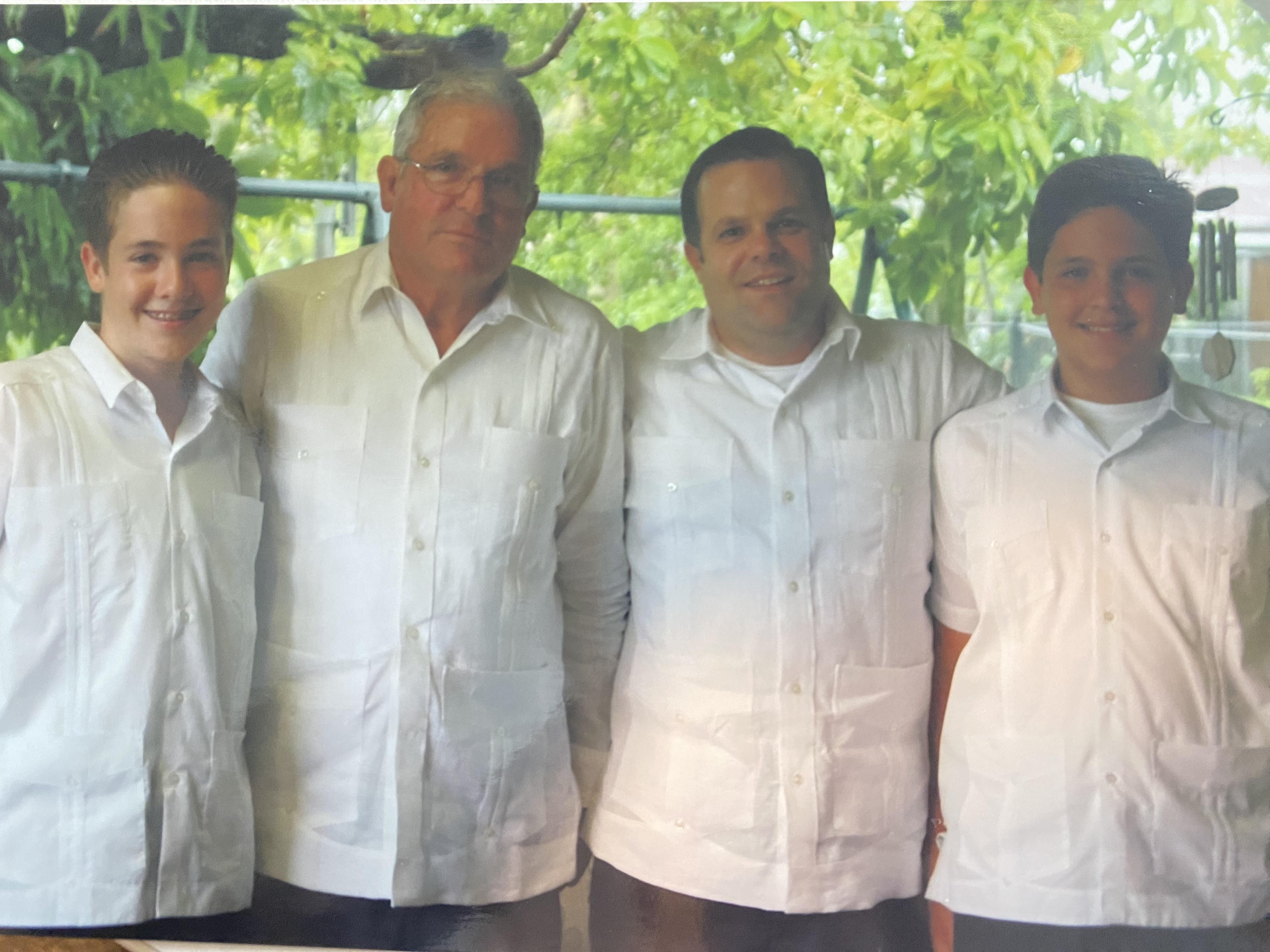 A group of men in white shirts