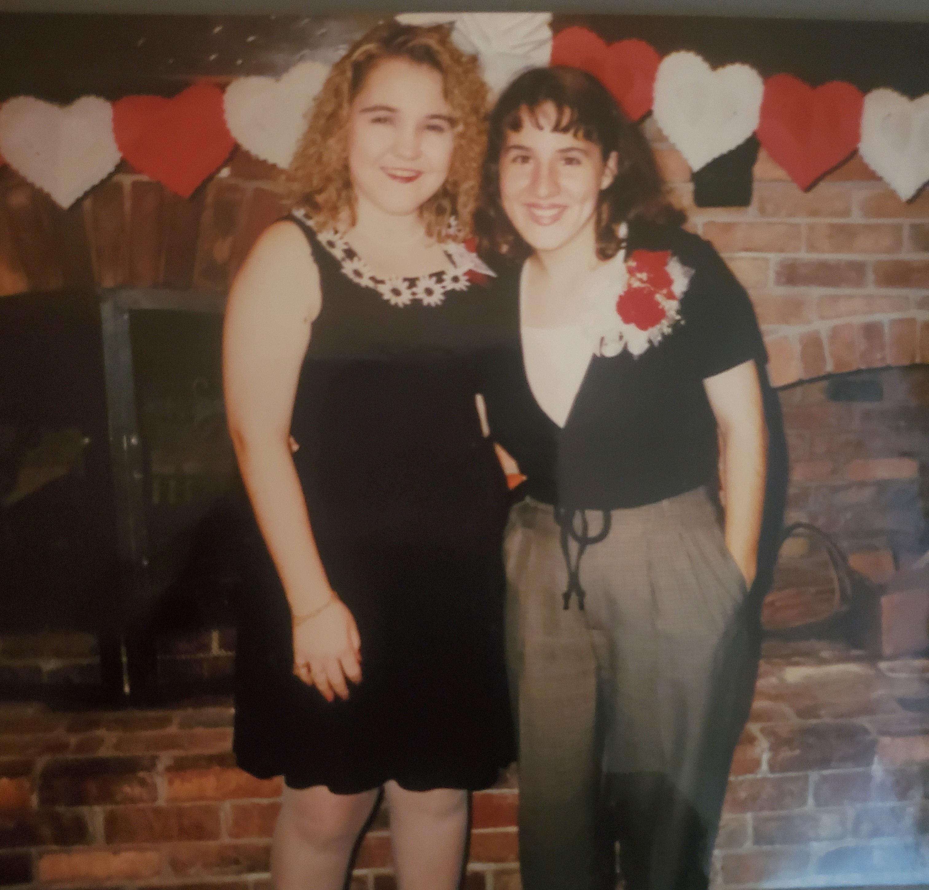 Two women standing next to each other