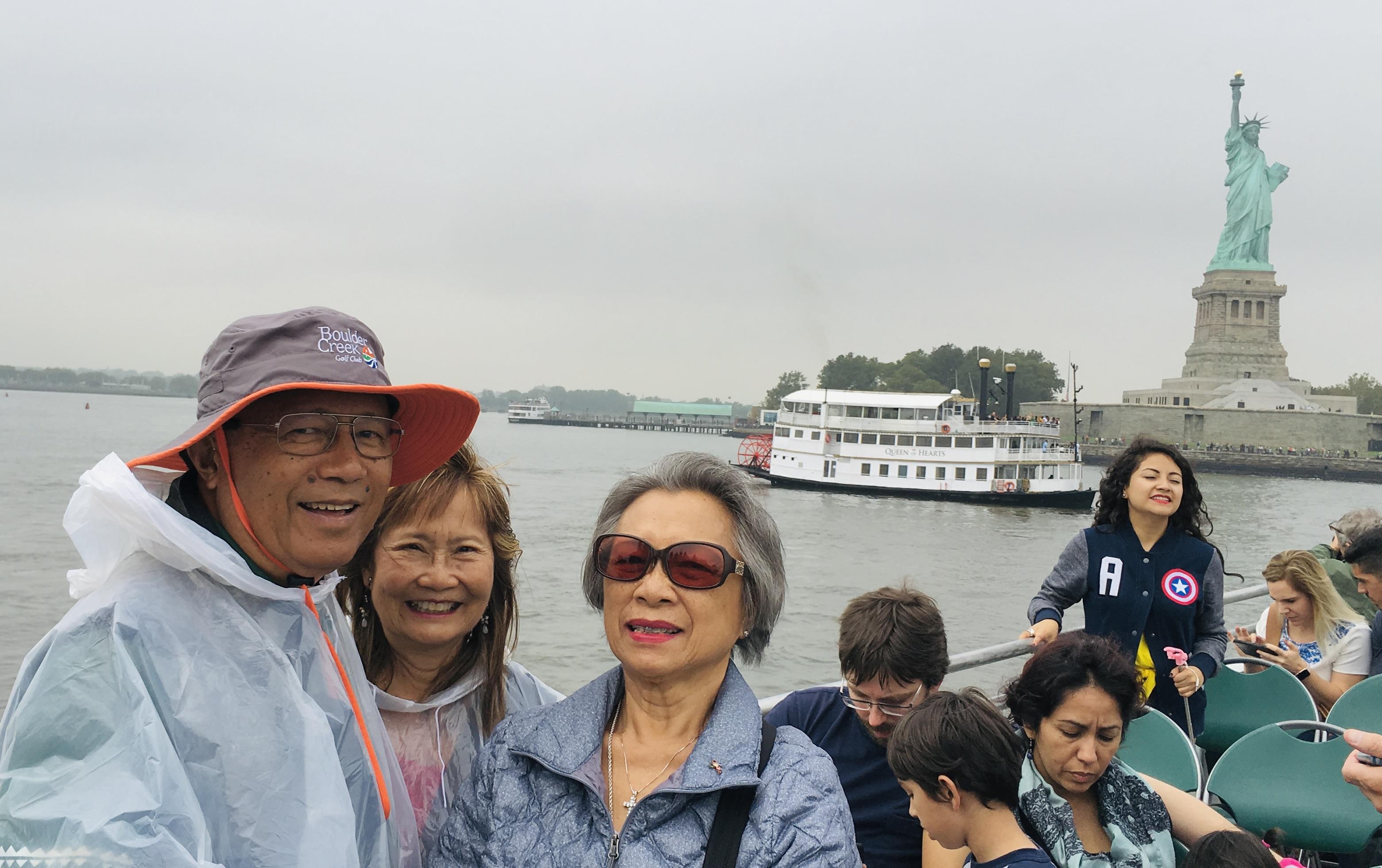 A group of people standing on a boat