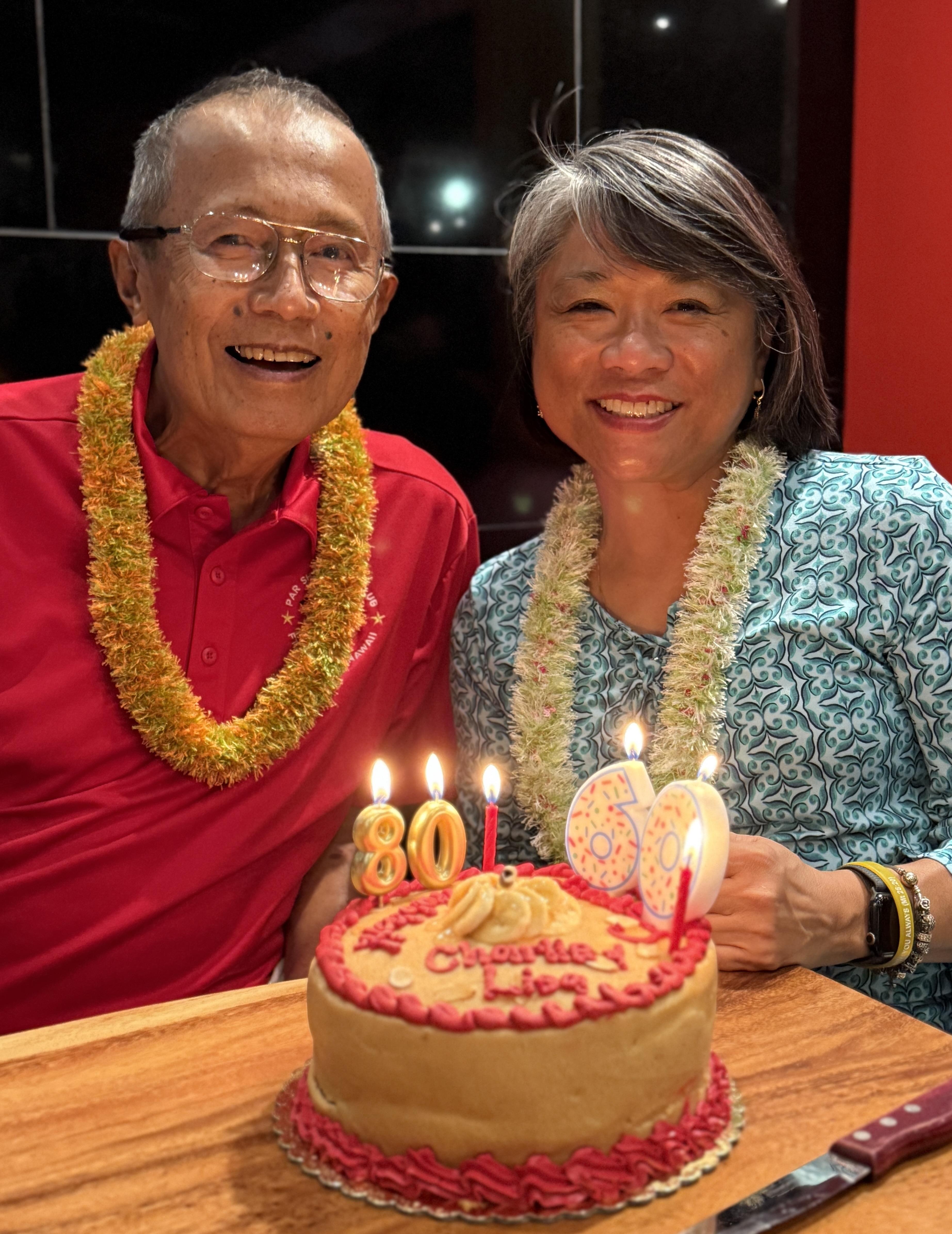 A man and woman smiling at camera