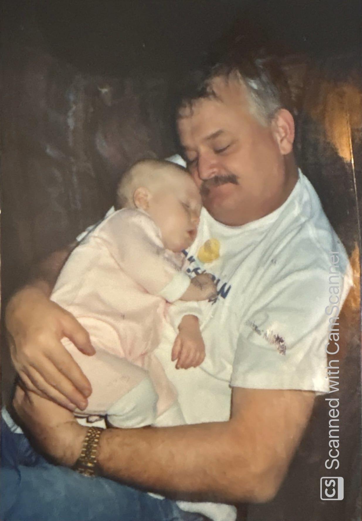 A man holding a baby