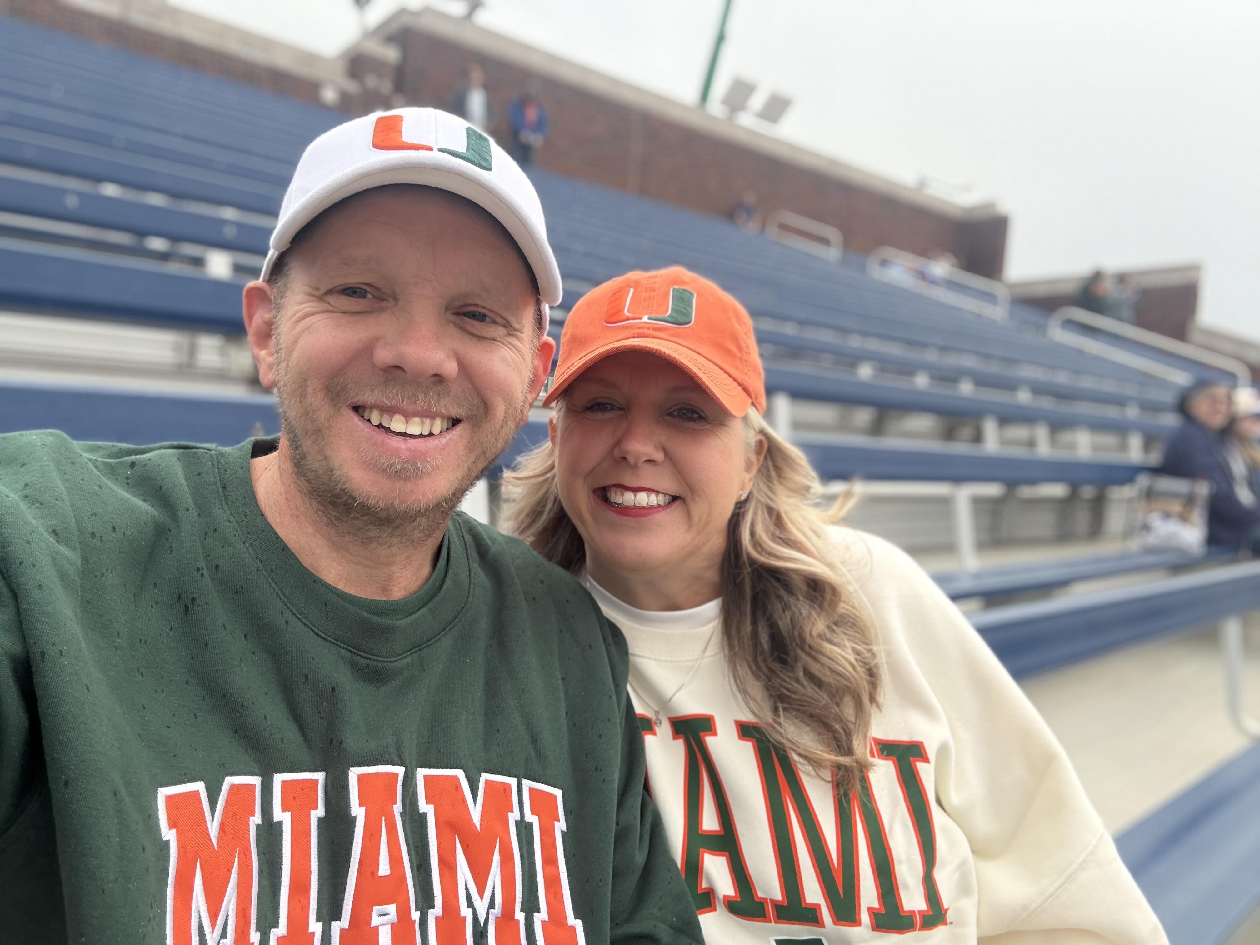 A man and woman posing for a picture