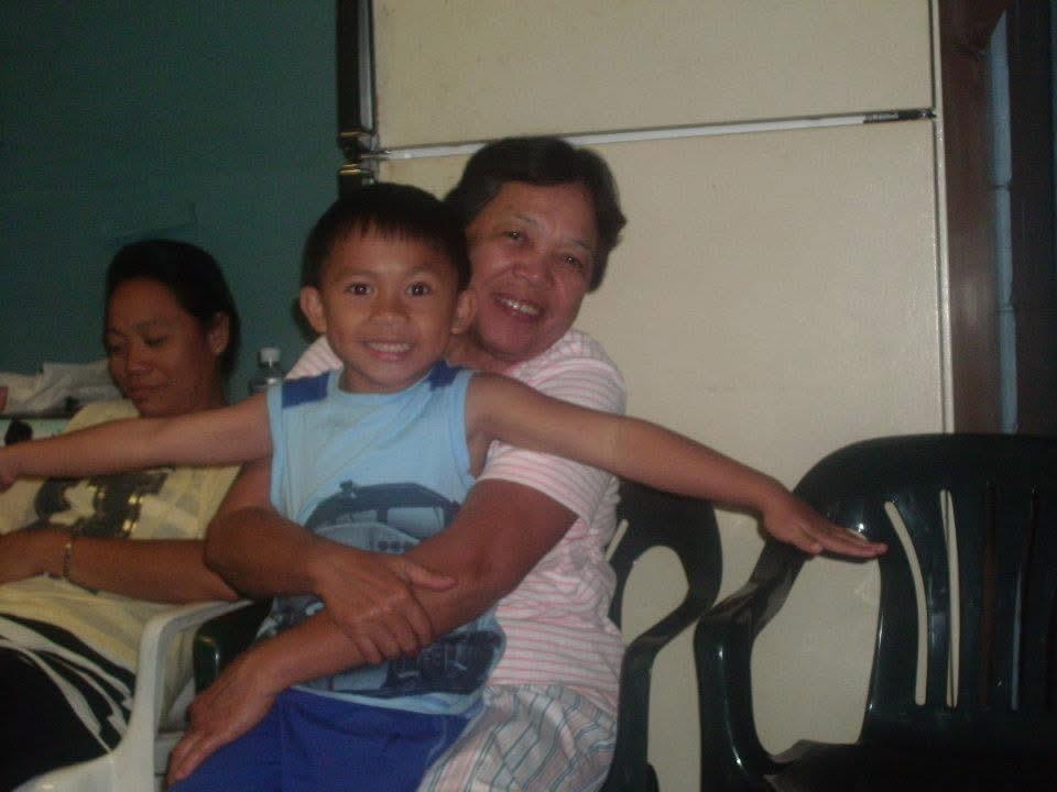 A woman and a child sitting on a chair