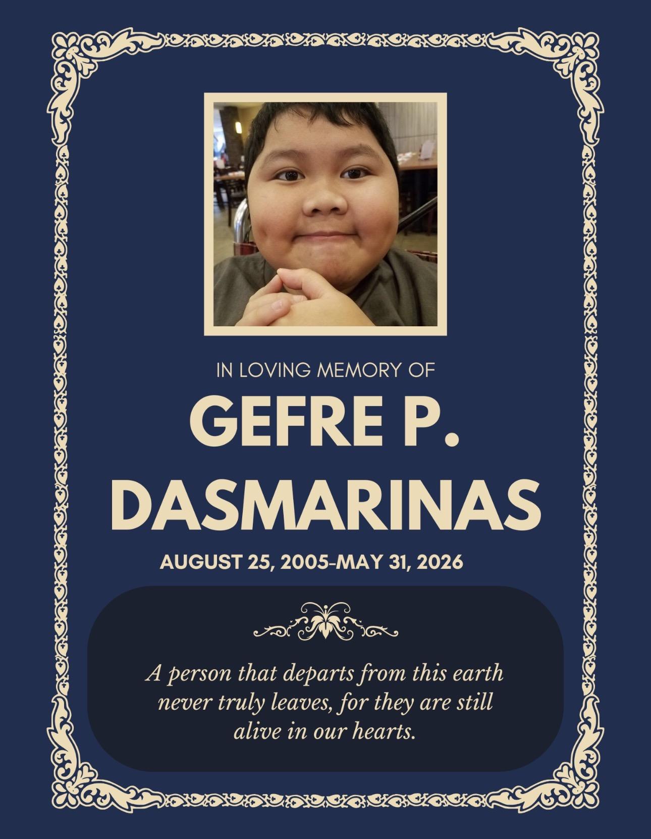 A blue and white memorial card with a child's face
