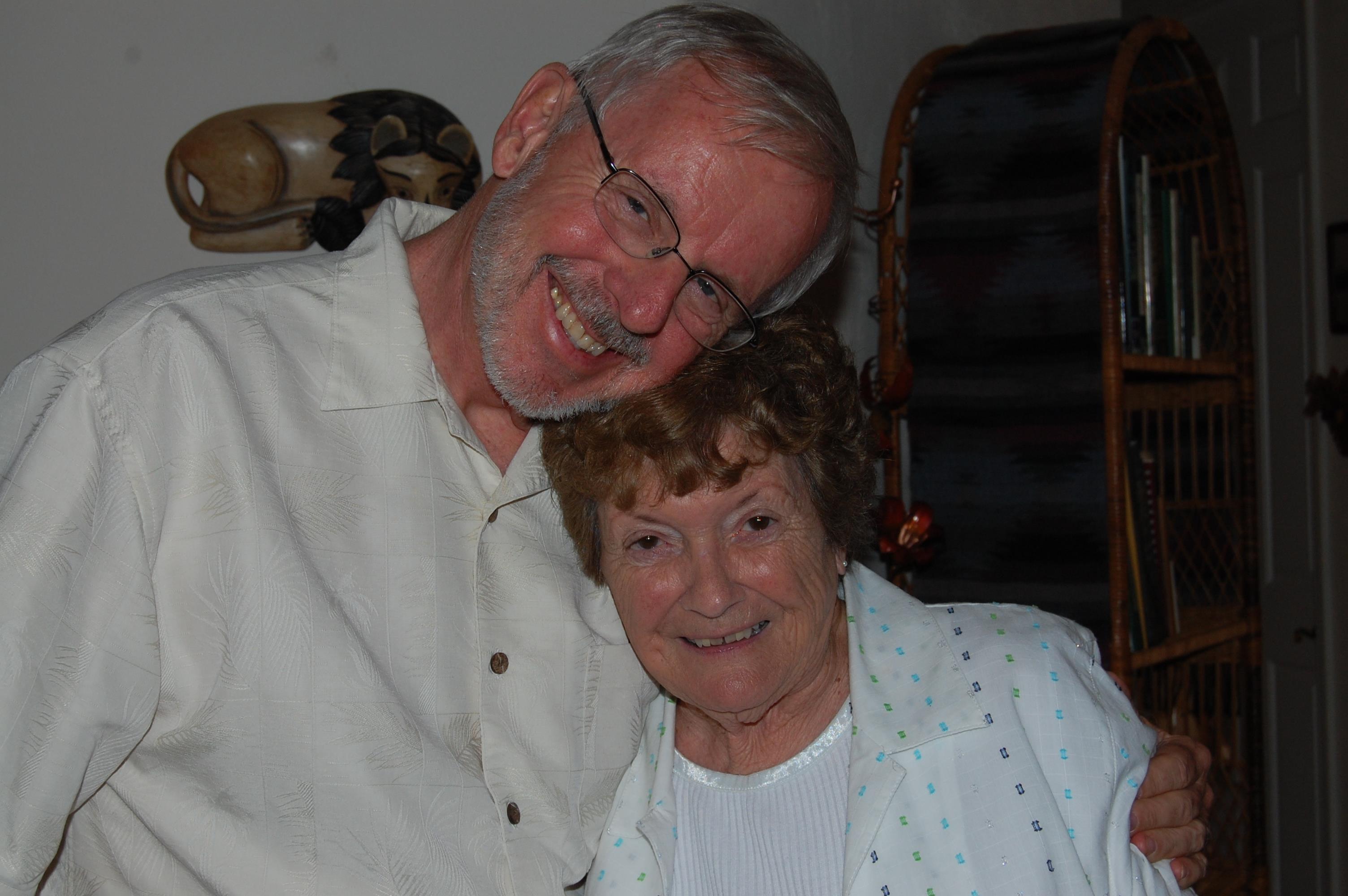A man and woman smiling