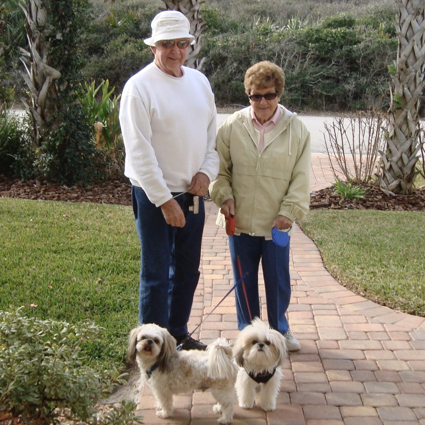 A man and woman with dogs