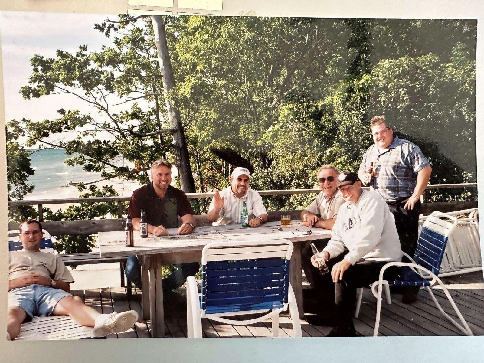 A group of men sitting at a table