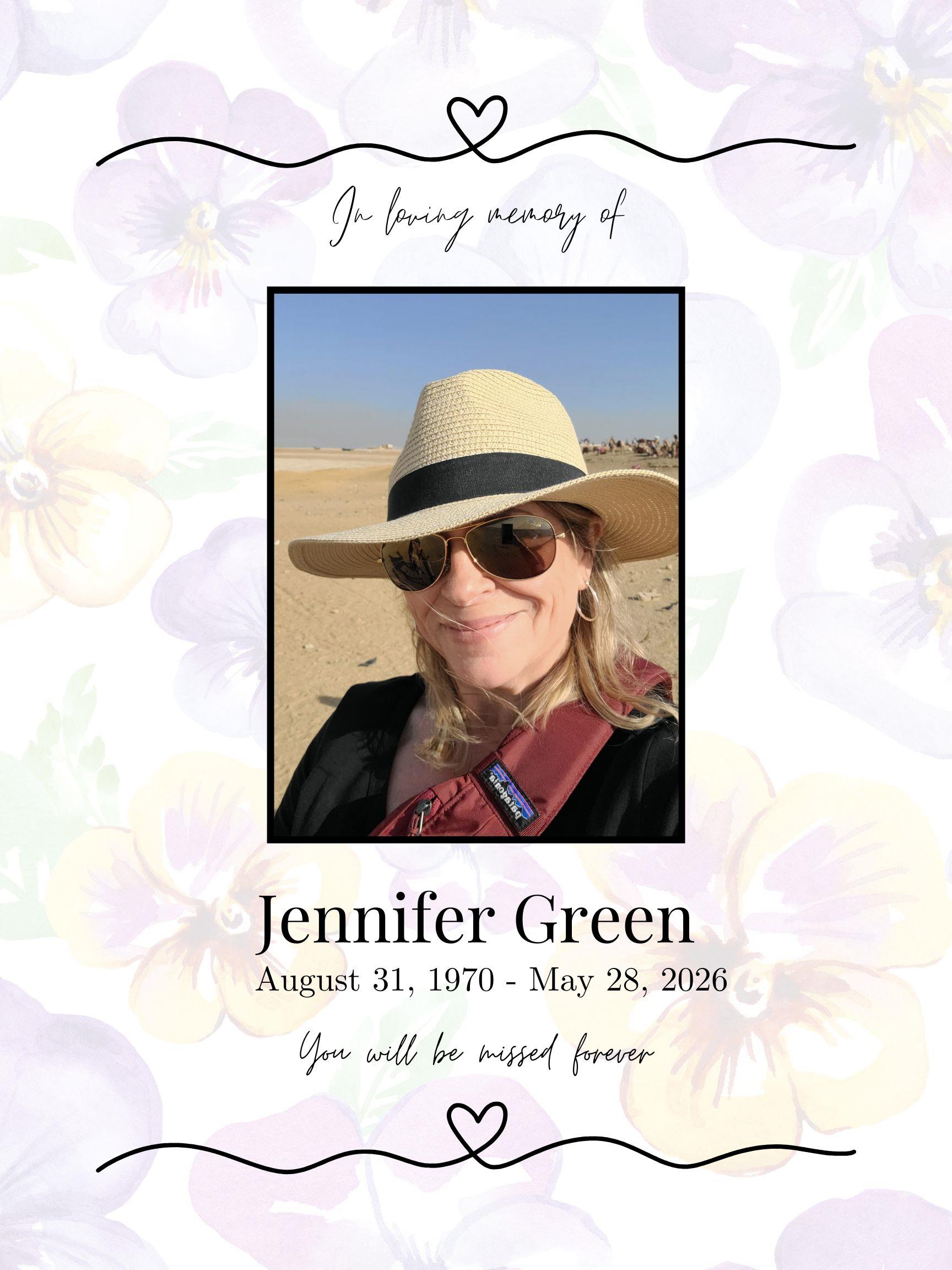 A woman wearing a hat and sunglasses