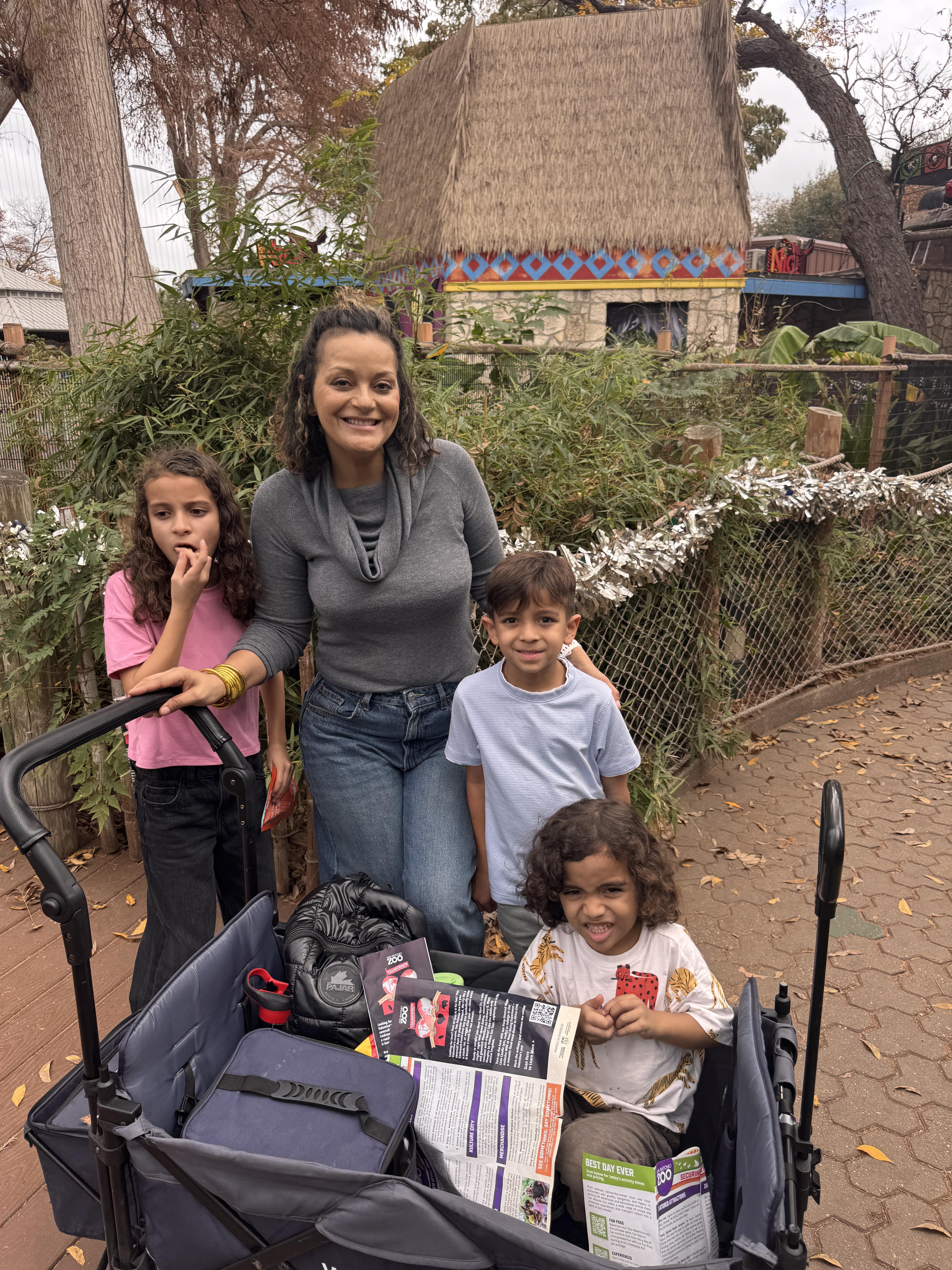 A woman and children posing for a picture