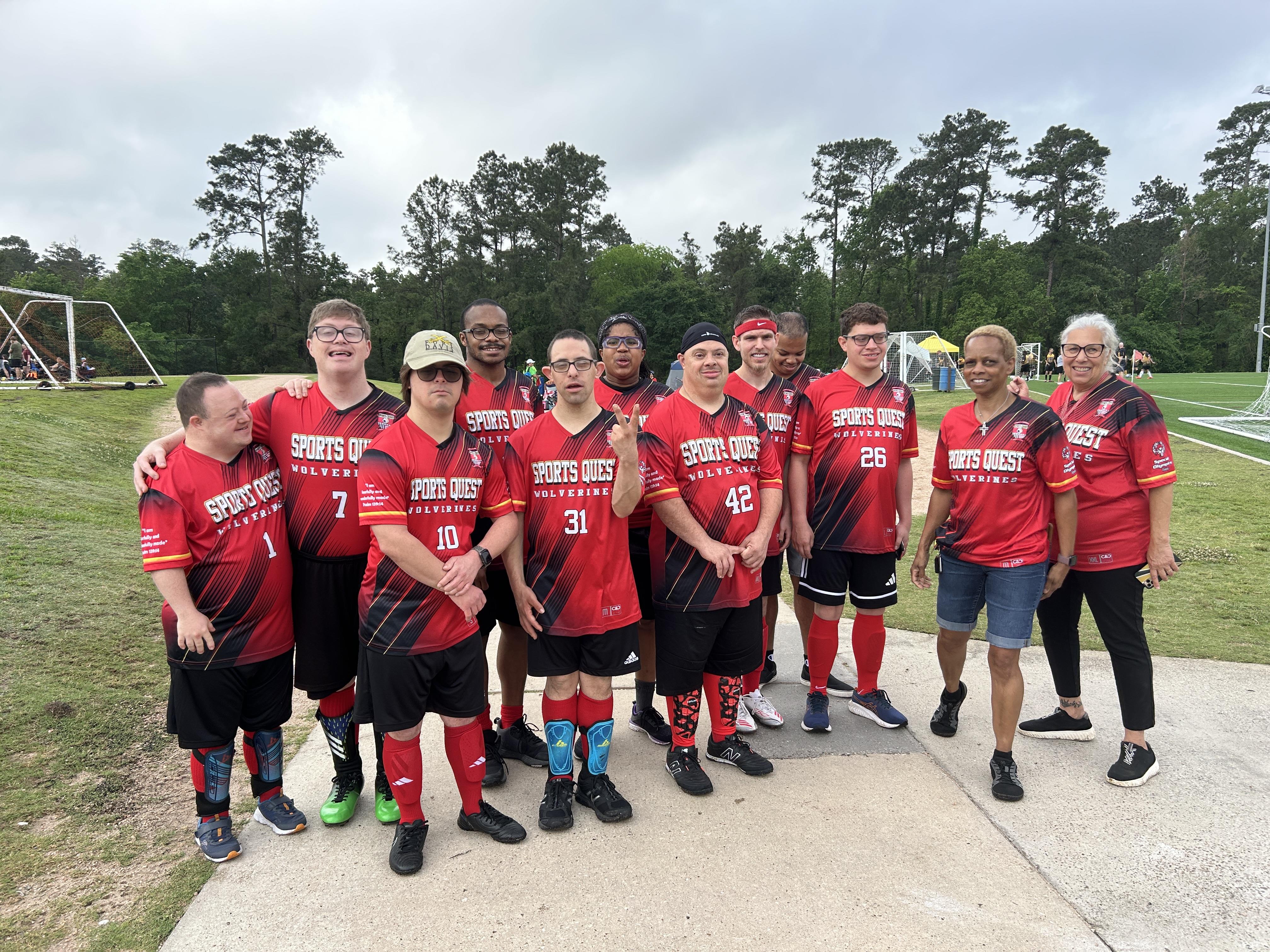 A group of people in sports uniforms