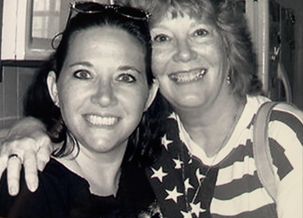 A couple of women smiling for a picture