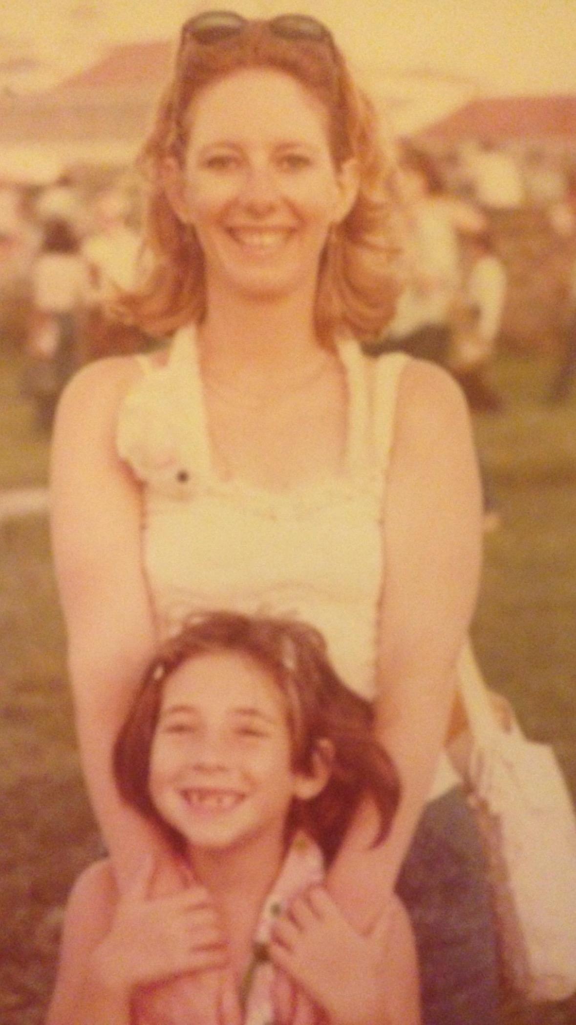 A woman and child posing for a picture