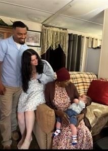 A man and woman with a baby