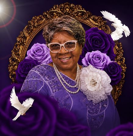 A woman in purple dress and white glasses with white doves around her neck