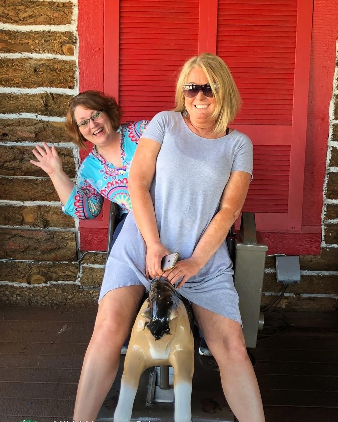 Two women sitting on a chair