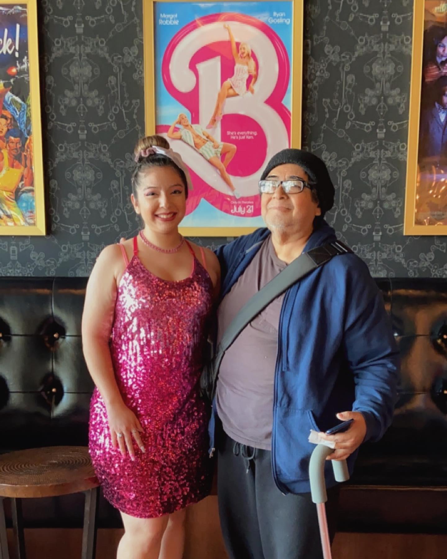 A man and woman posing for a picture