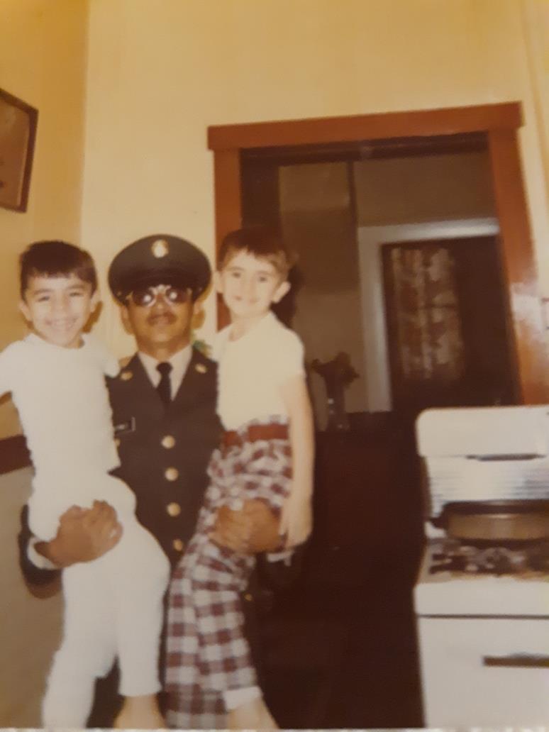 A man holding two children