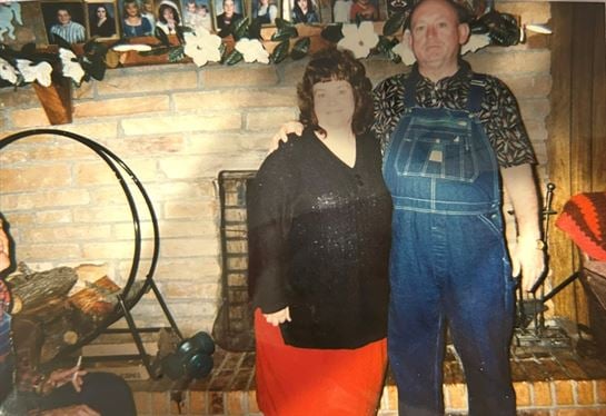 A man and woman standing next to each other