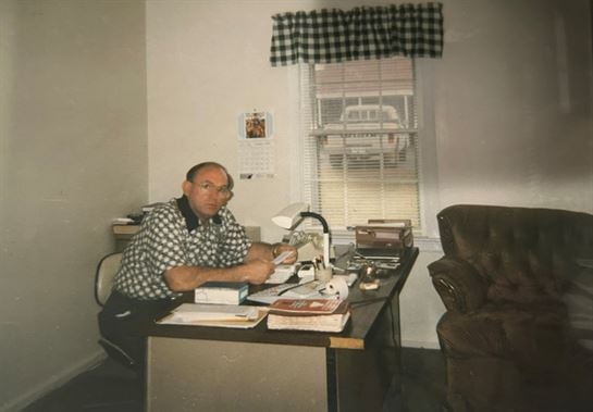 A man sitting at a desk