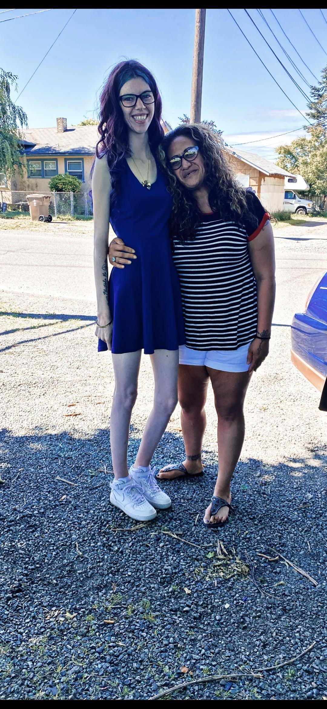 Two women standing next to each other