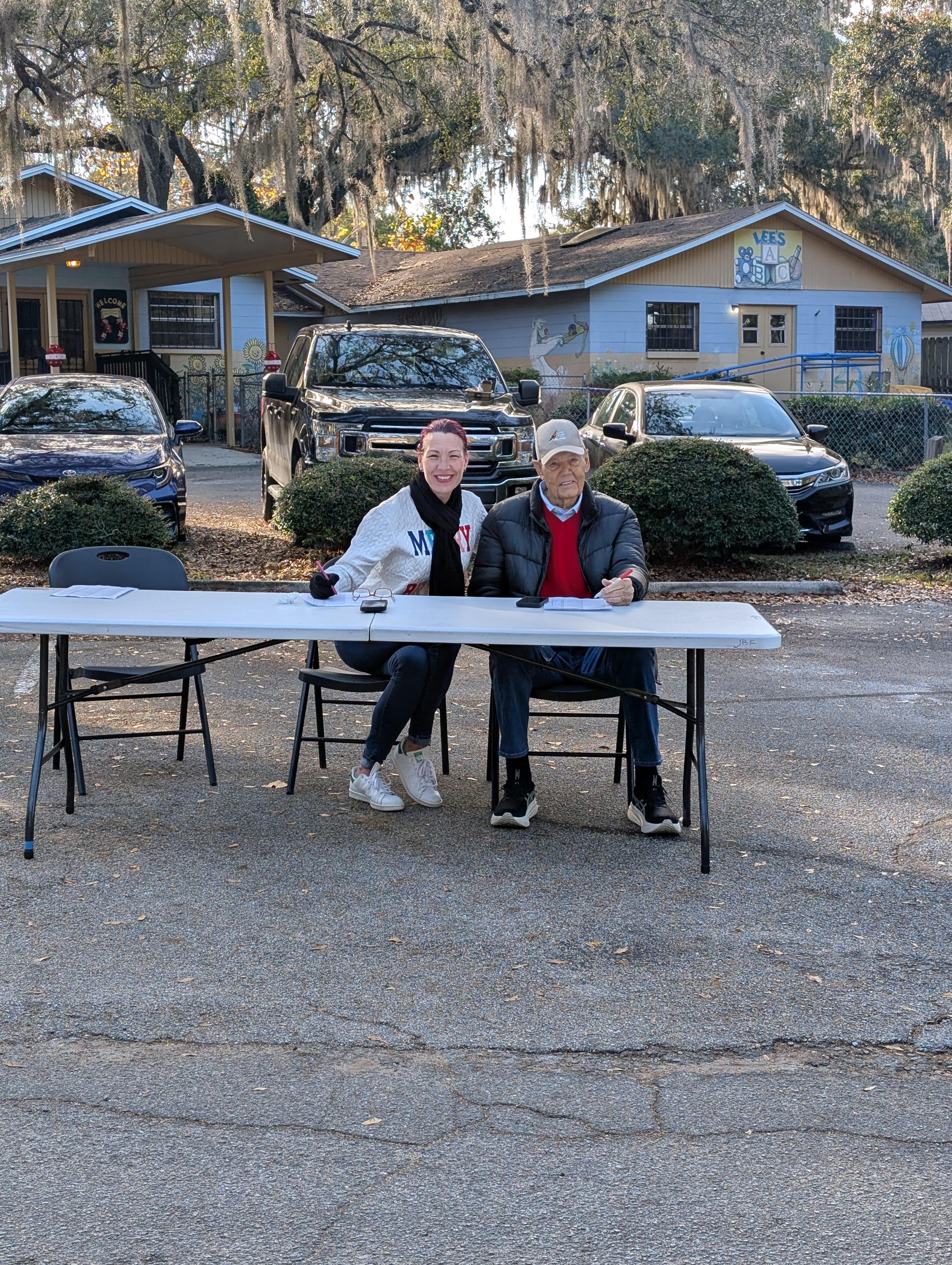 A man and woman sitting at a table