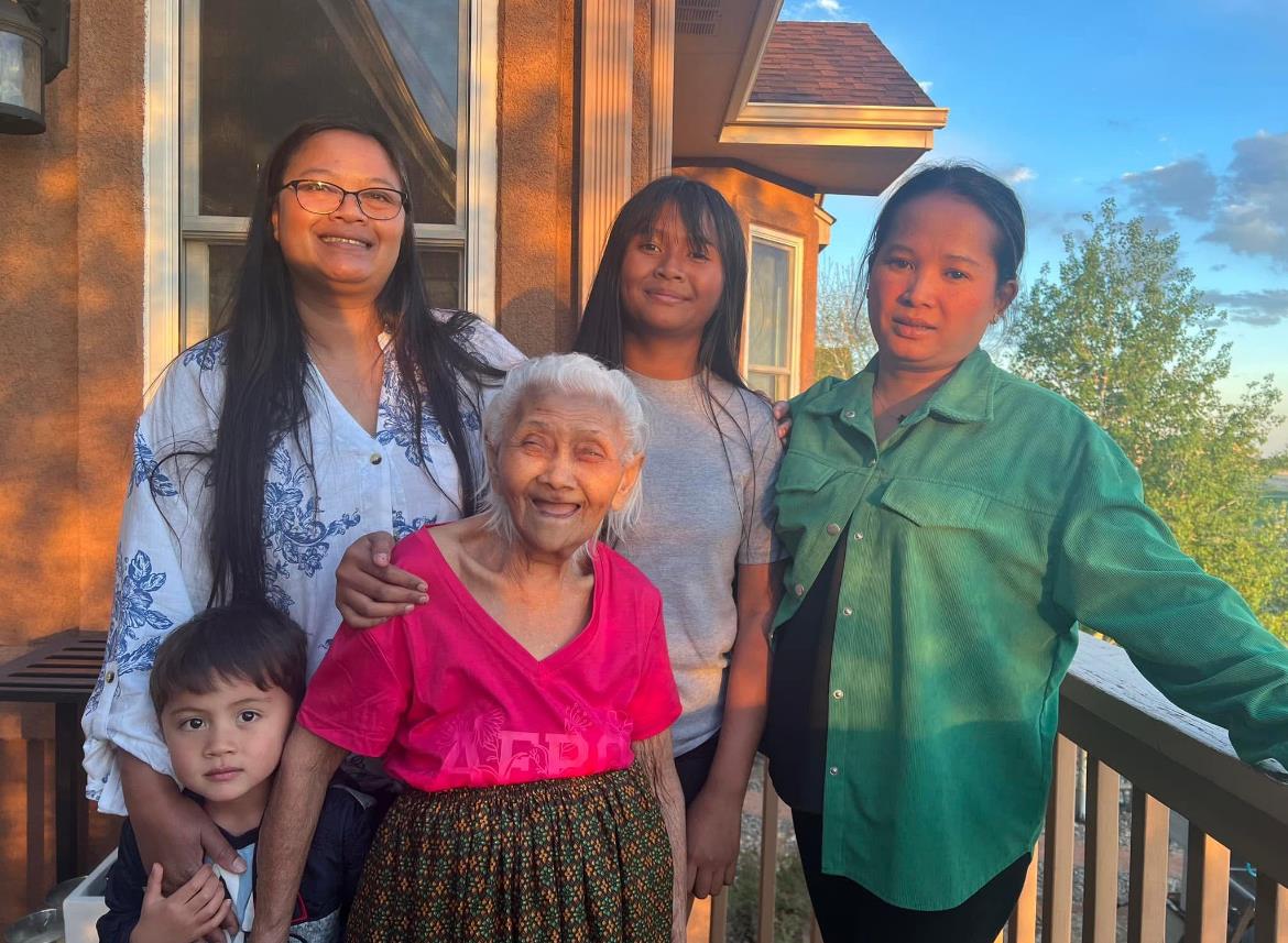 A group of people standing on a porch