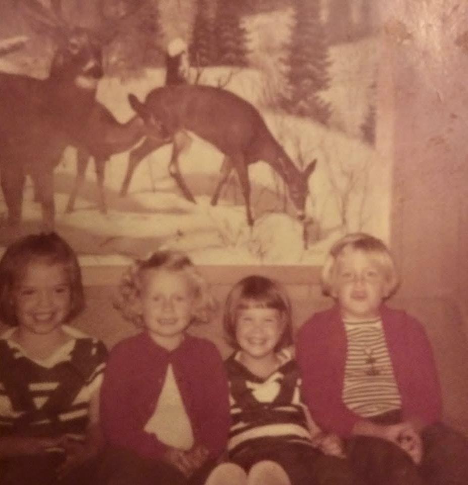 A group of children sitting on a couch