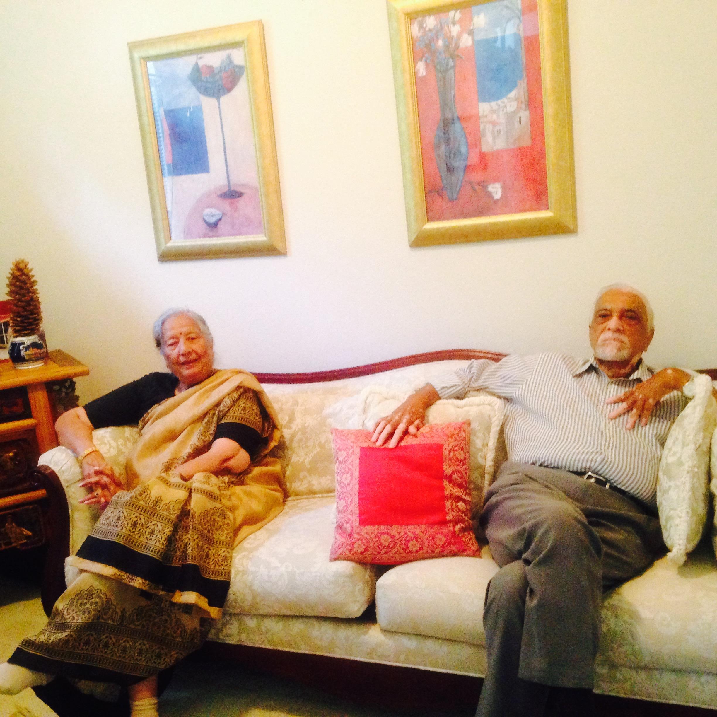 A man and woman sitting on a couch