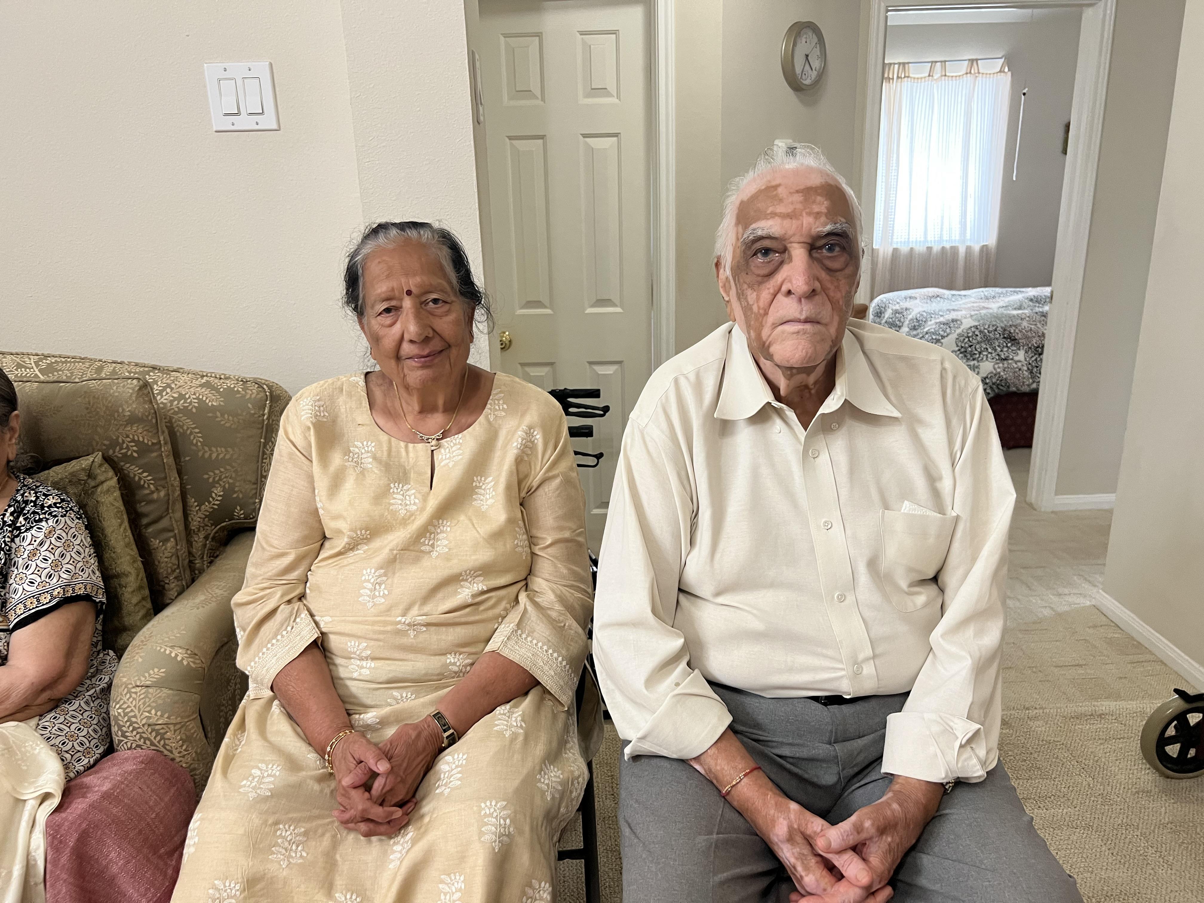 A man and woman sitting on a couch