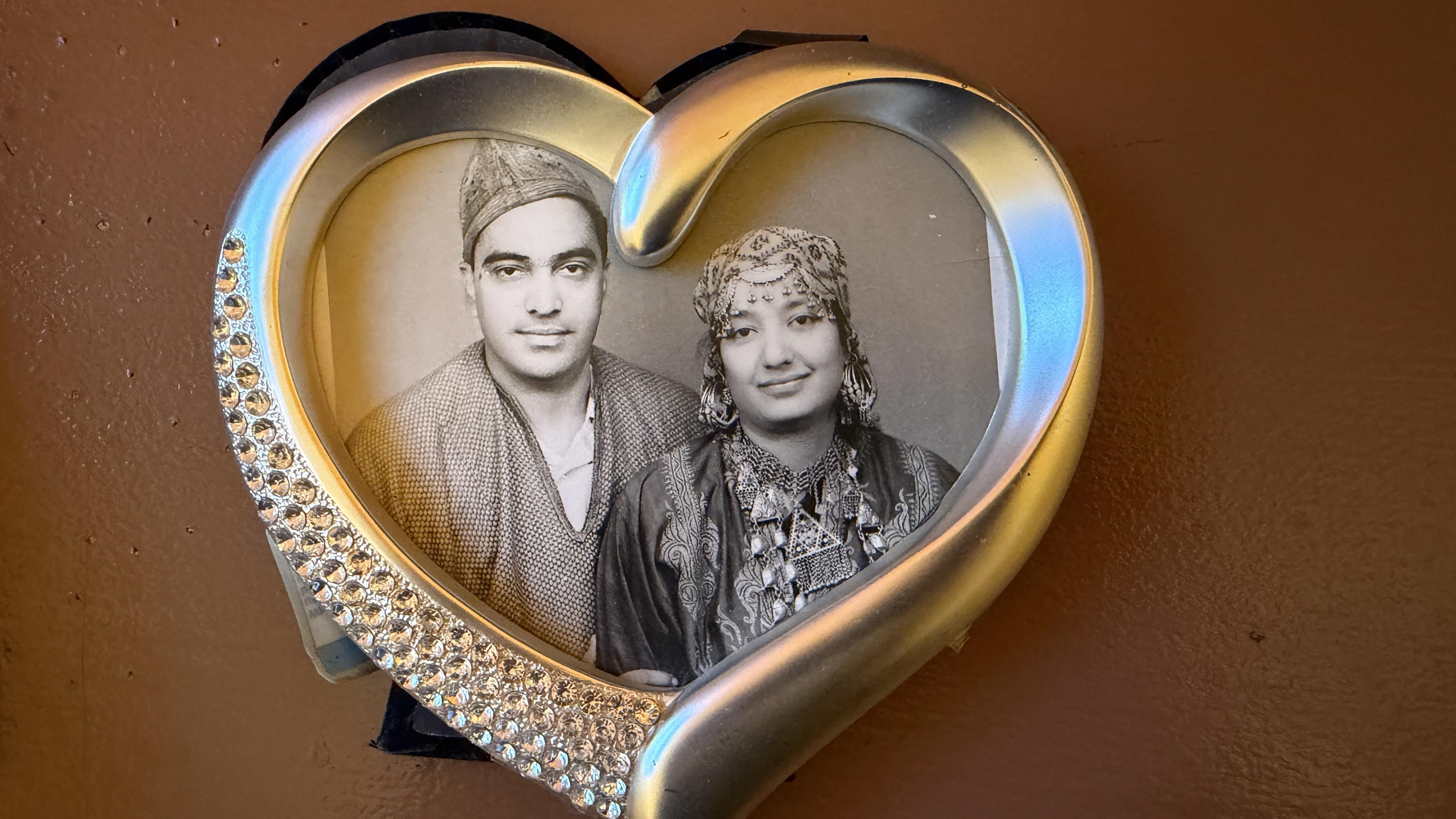 A picture frame with a couple in the middle