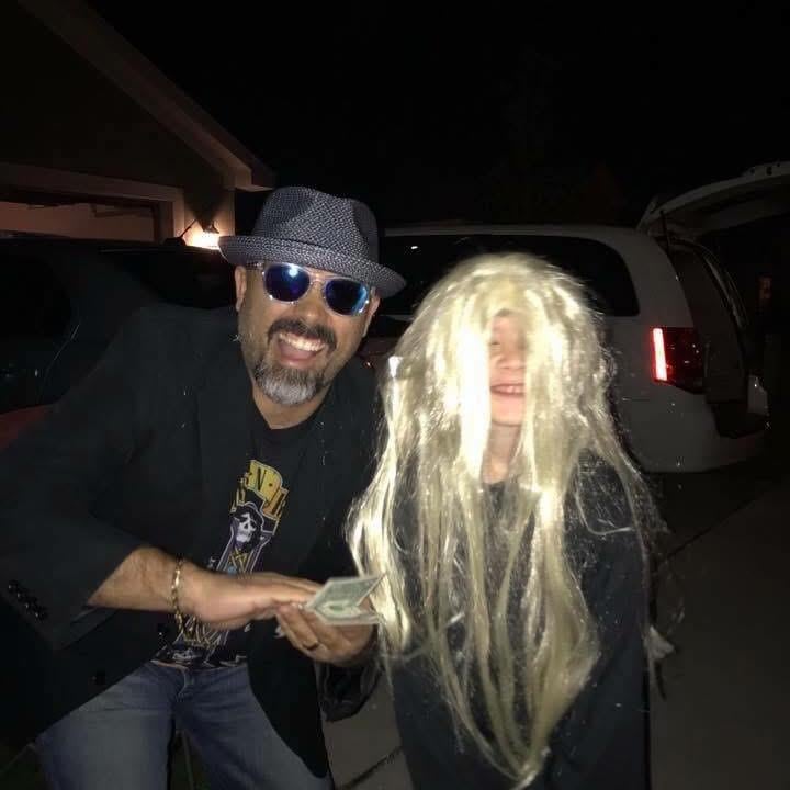 A man and child in a wig