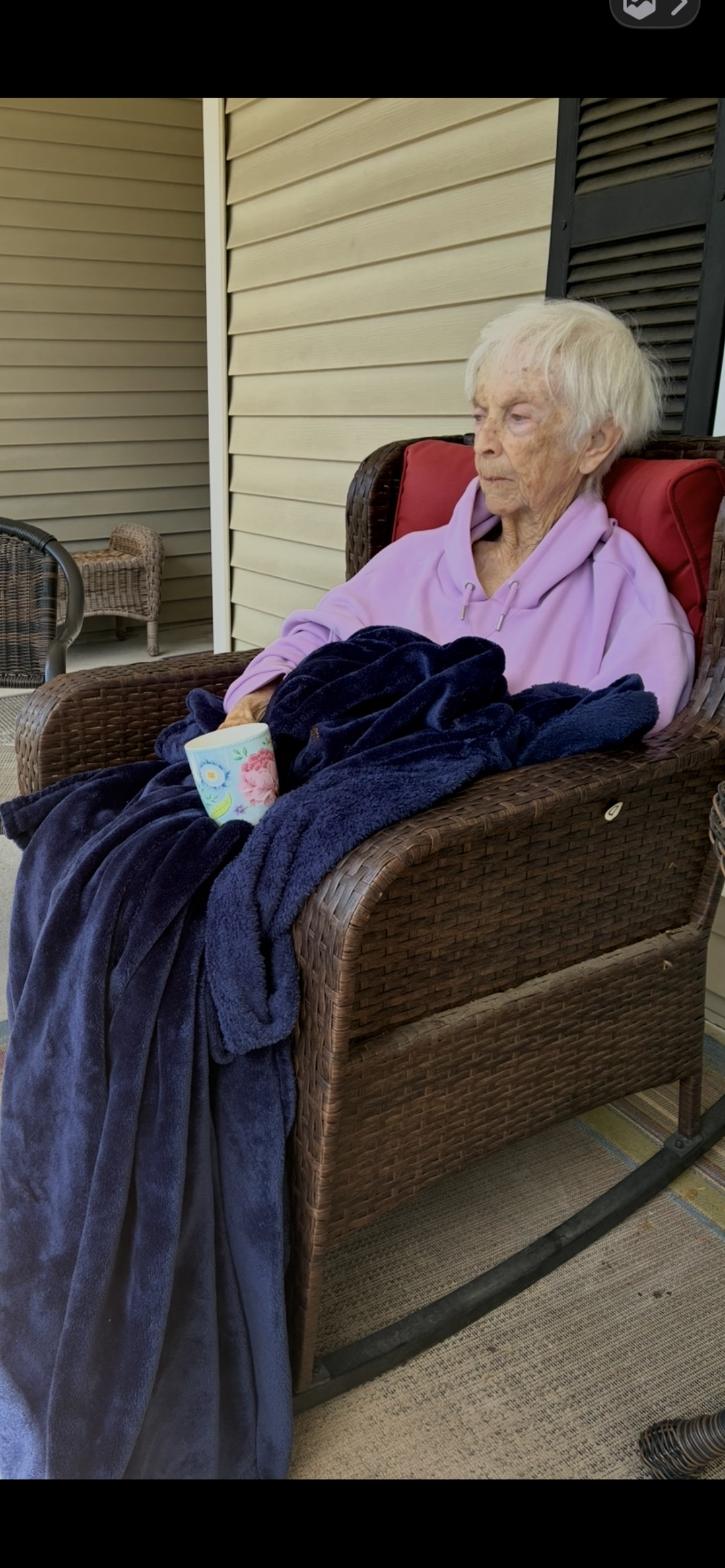 An old woman sitting in a chair