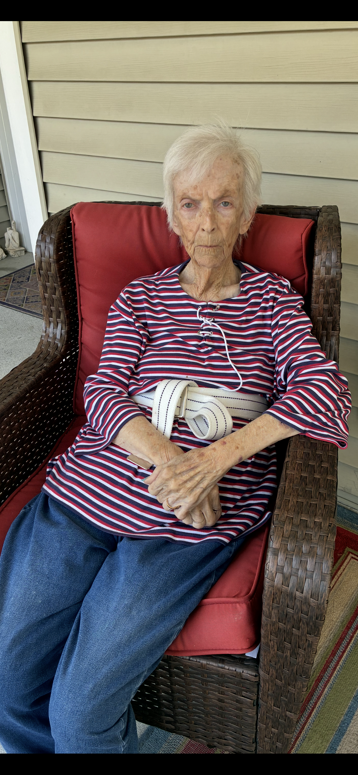 An old woman sitting in a chair