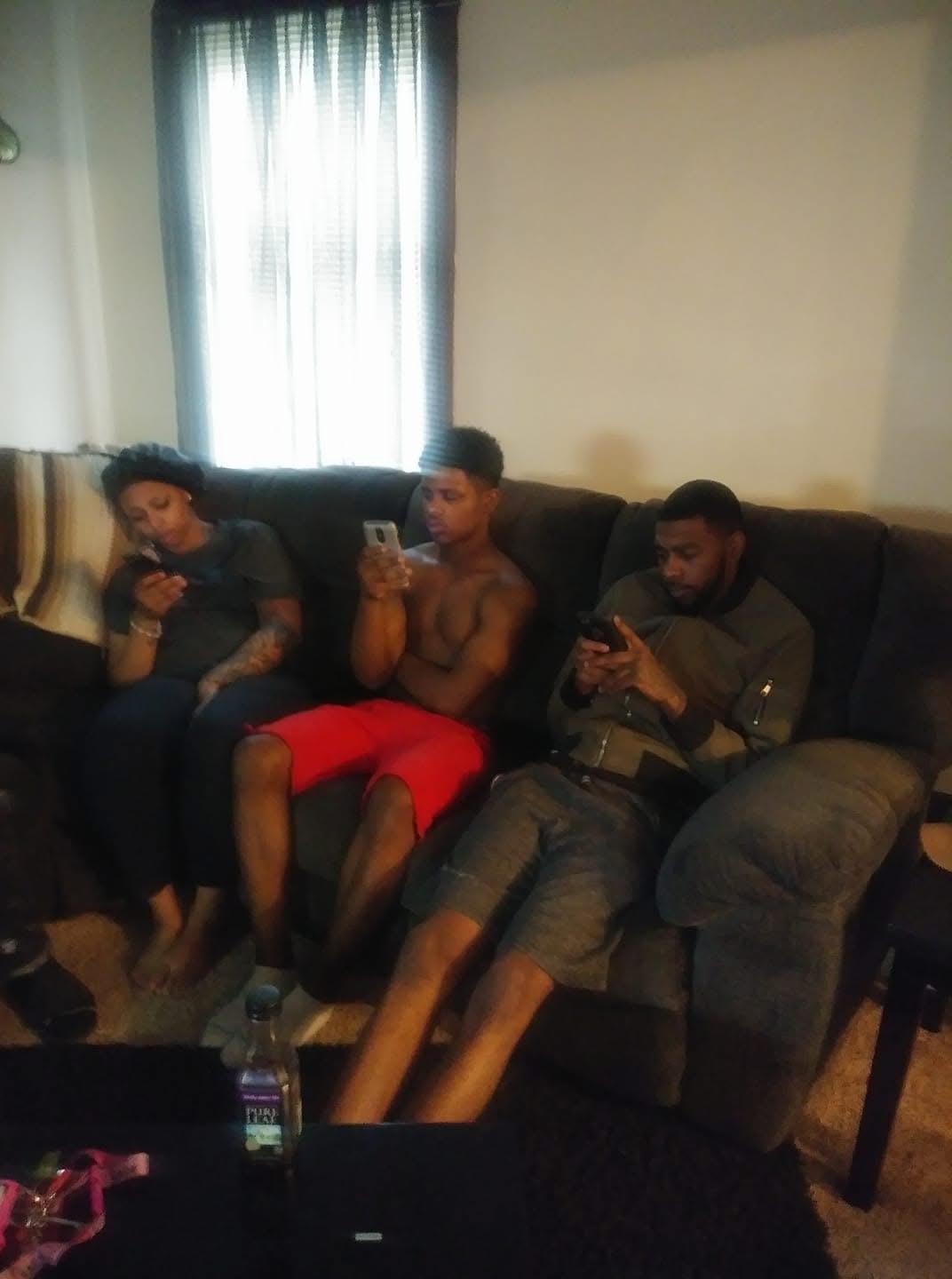 A group of people sitting on a couch