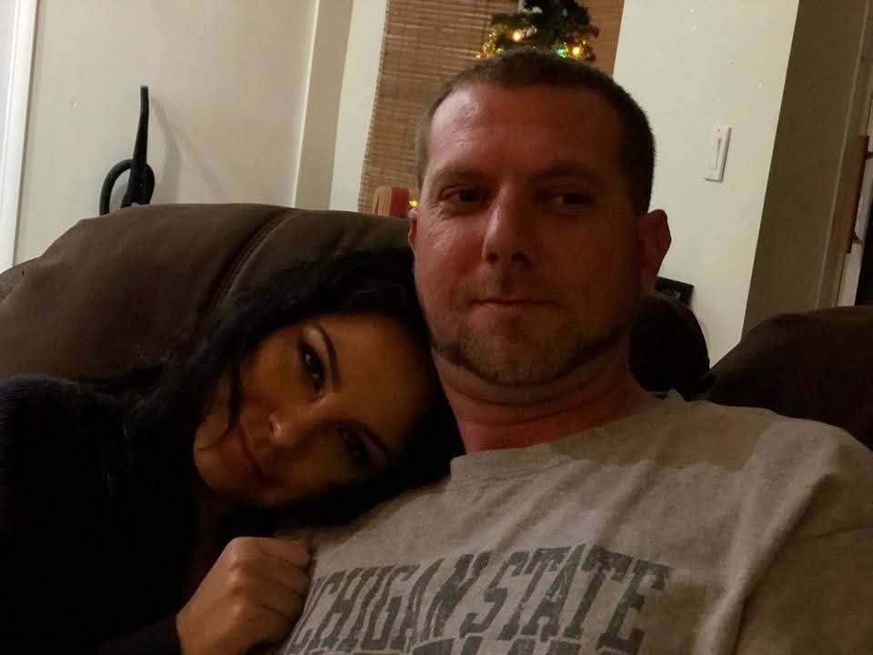 A man and woman sitting on a couch