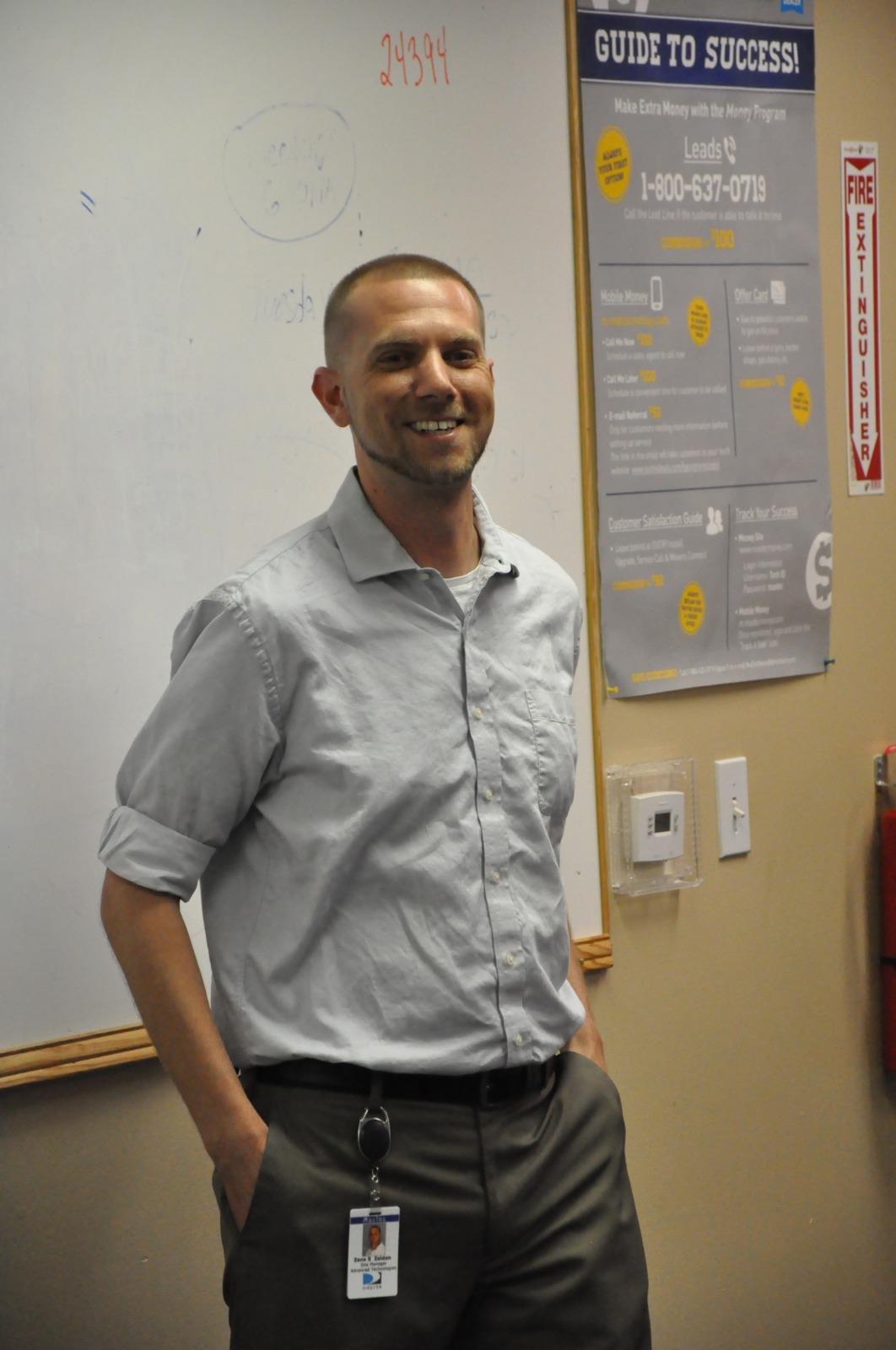 A man standing in front of a whiteboard