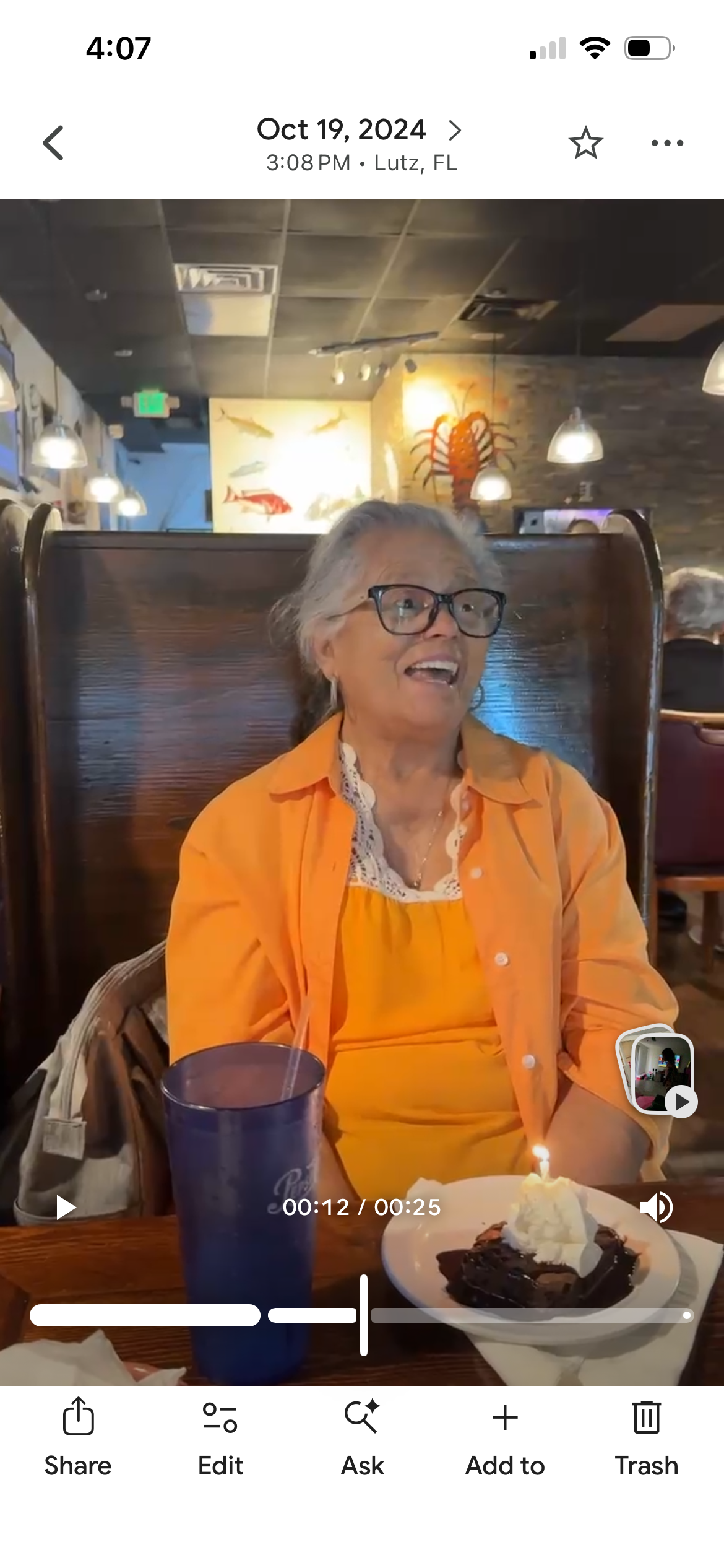 A woman sitting in a booth