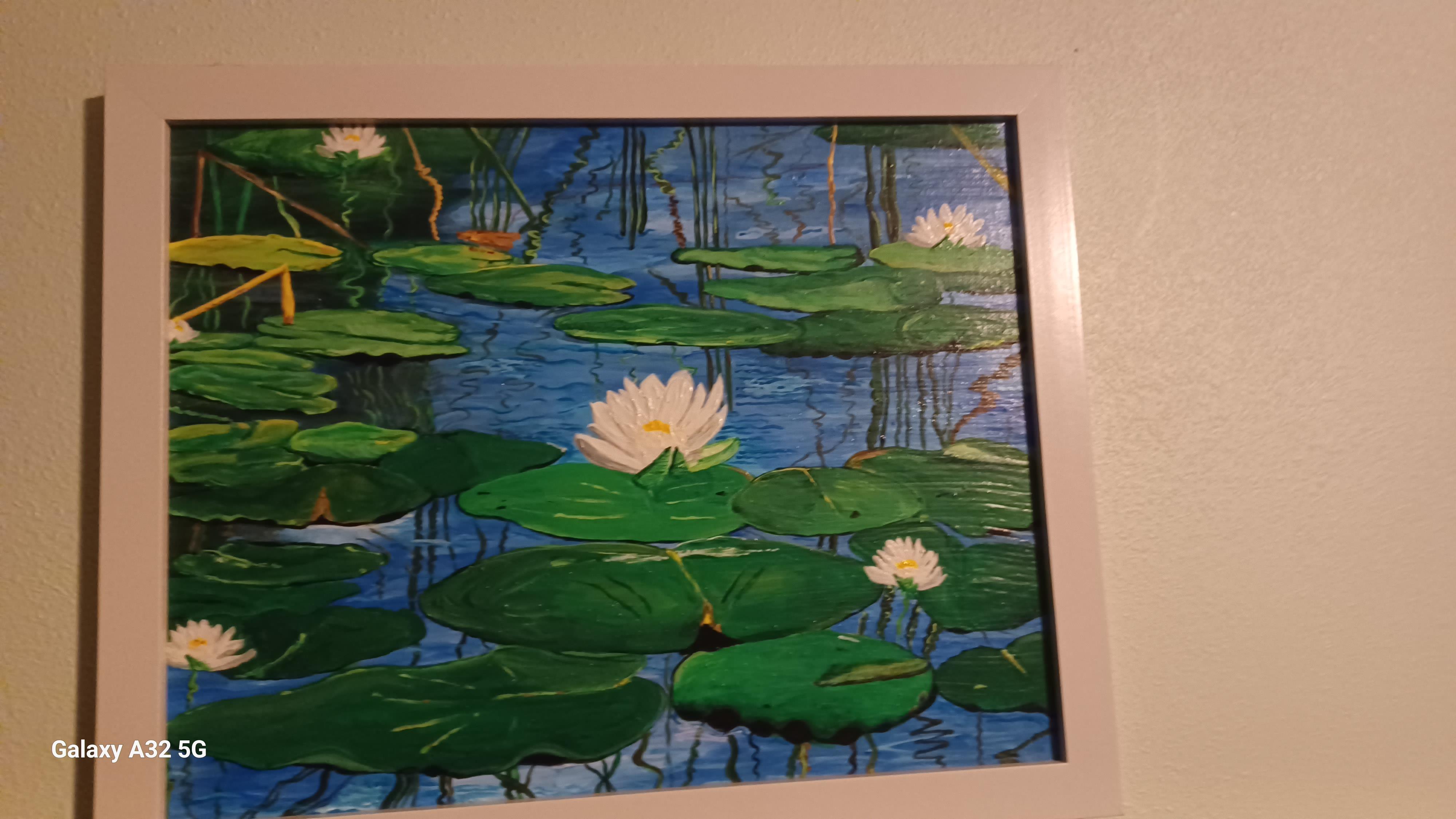 A painting of lily pads and water lilies